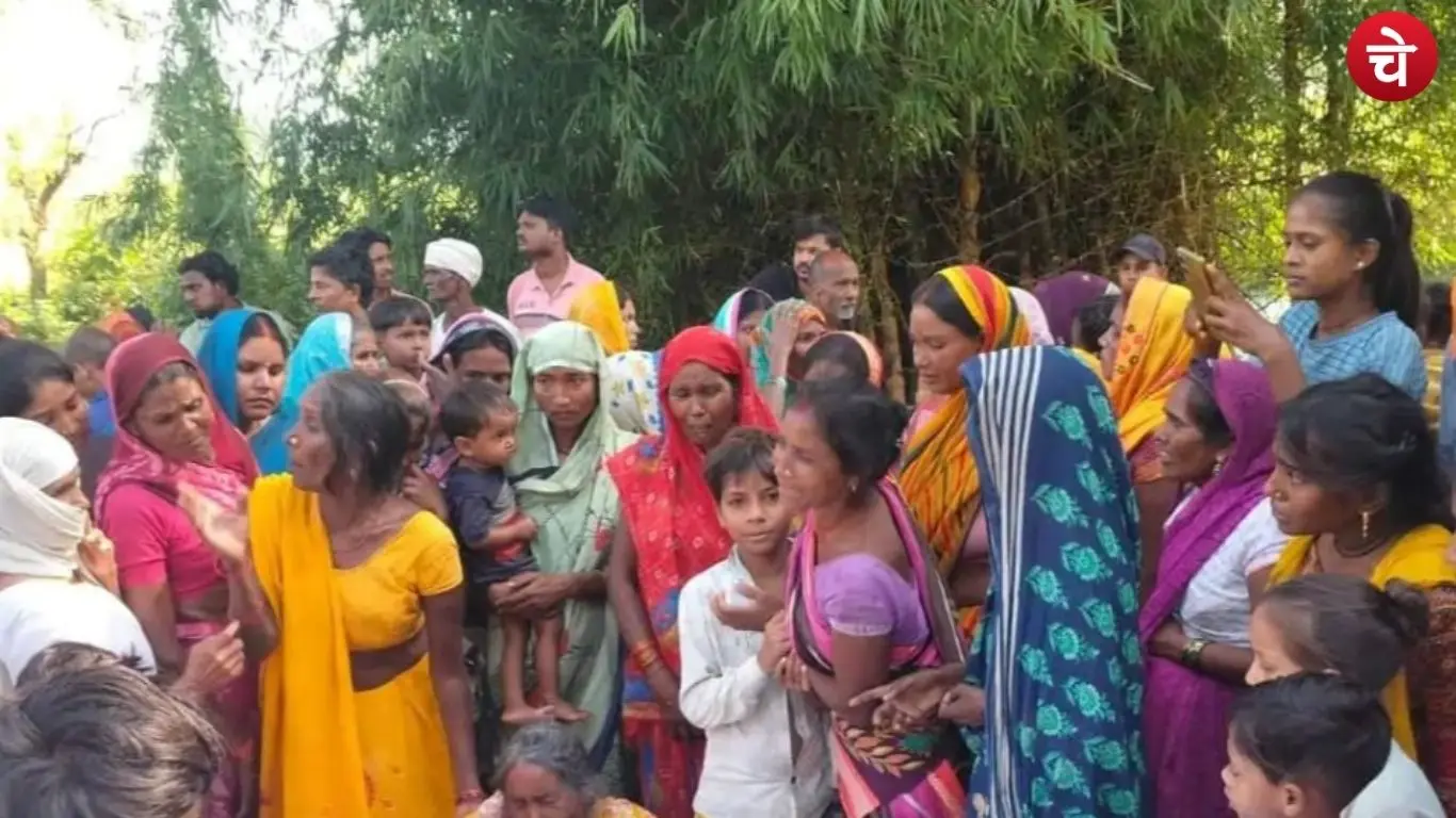 A crowd of villagers gathered at the scene after a body was found in the pond